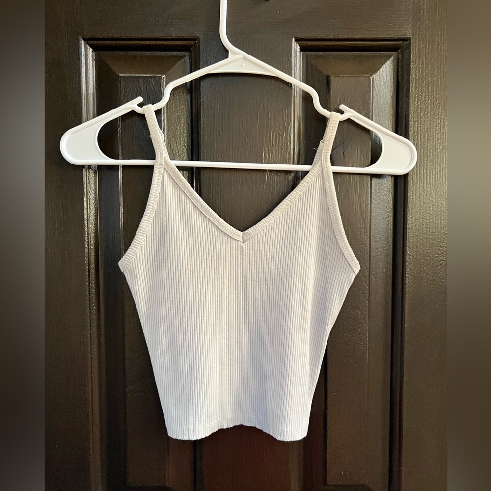 Cute mid length tank top.